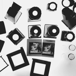Camera equipment, film slides, and stereography tools for creative photography projects.